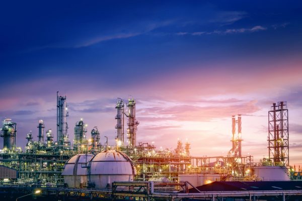 Oil and gas refinery plant or petrochemical industry on sky sunset background, Factory with evening, Manufacturing of petrochemical industrial